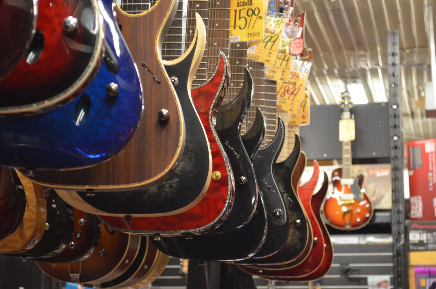 Row of Guitars A row of hanging guitars