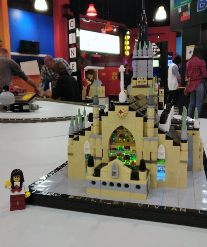 The Lego cathedral in person, with a minifigure for scale.
