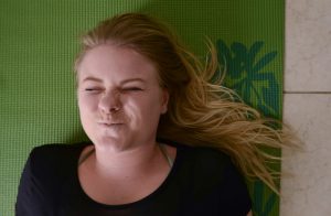 blond woman scrunching her face