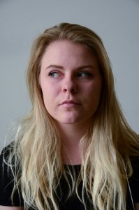 Blonde haired woman looking left