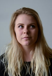 Blonde haired woman looking right