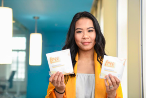 Allisa Lim with IGNITES’ free menstrual kits back in 2018 Photo: IGNITE